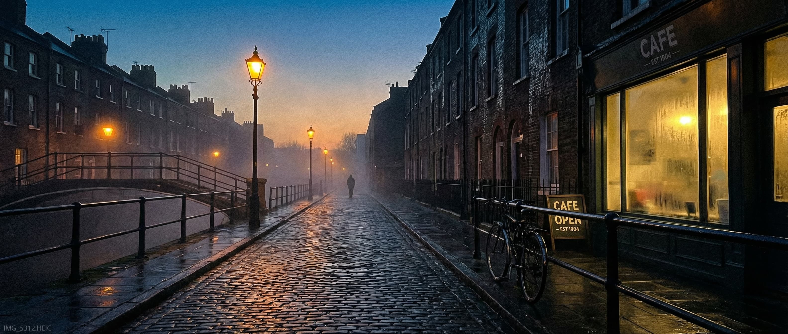 East London street at dawn, misty cobblestones
